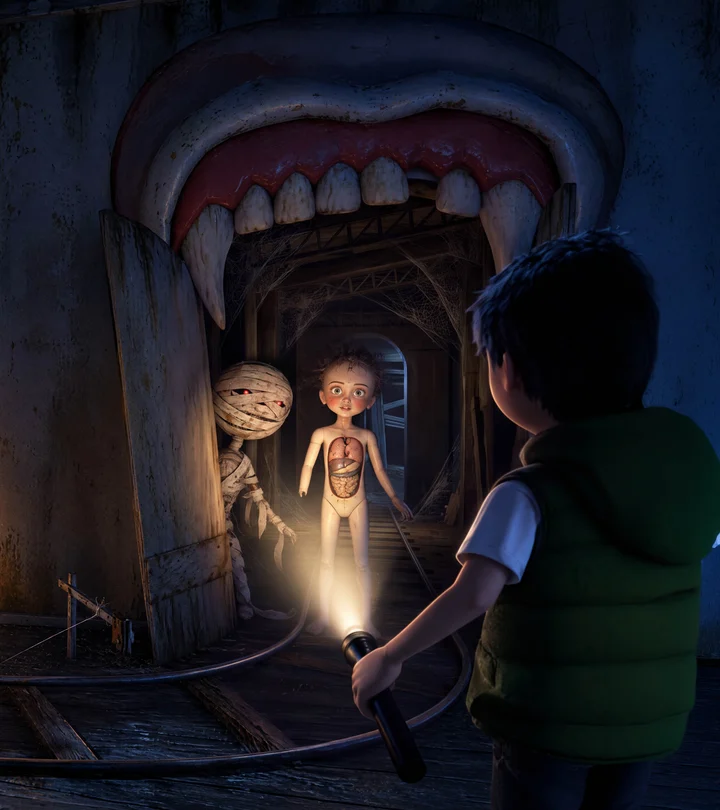 A bandaged mummy character and a translucent anatomical girl standing together in a dark ghost-train archway, lit by a flashlight