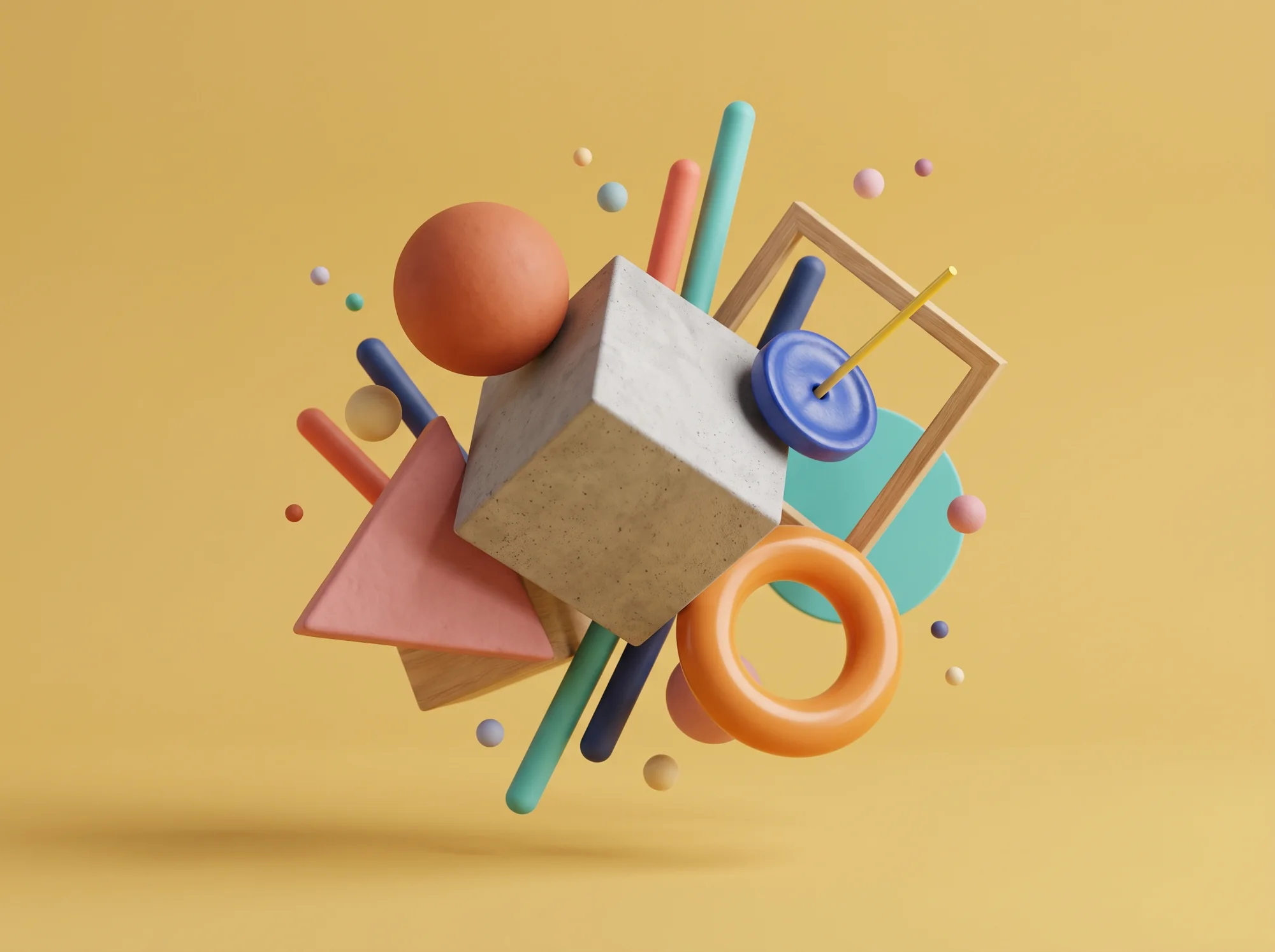 Cluster of shapes on ochre — concrete cube, orange sphere, pink triangle, wooden frame, teal rods and an orange torus